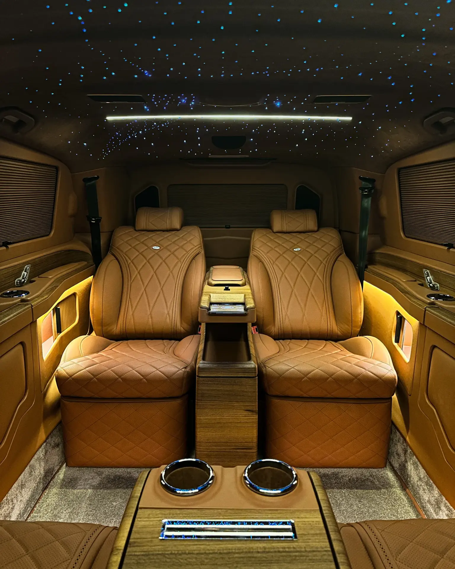 Hand-finished lounge interior of an Ola VIP Cars chauffeur van